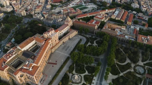 Cinematic flight in the pre-dawn hour over the Palazzo dei Normanni, and Cappella Palatina in the historic part of Palermo. Sicily. Aerial shoot