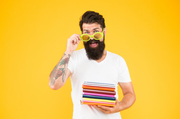 Got back into teaching. School teacher hold books. Bearded man teaching literature. Pedagogical...