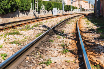 Obraz premium Two lines of parallel train tracks in opposite directions, seen from below.