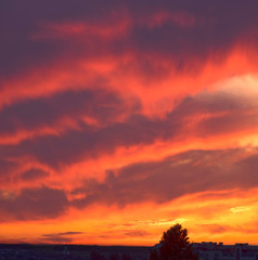 The bright fiery colors of sunset in the mountains are a beautiful sight. Red clouds can be used as background in digital processing.