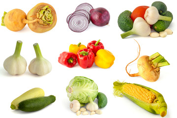 Ripe turnips red onions garlic cucumbers tomatoes Bell peppers eggplant cabbage and corn cob on a white background