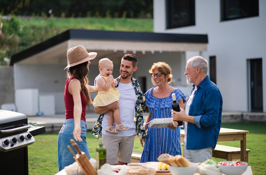 Portrait of happy people outdoors on family birthday party.