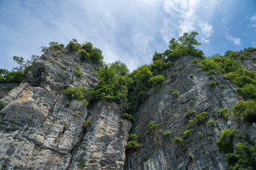 Thai Island cliff face with cloudy sky (Ko Bida Nok)