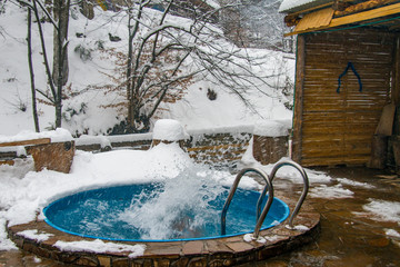 Swimming pool for swimming in cold healing water in winter