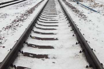 Railway tracks for trains, sleepers and rails in winter, snow.     