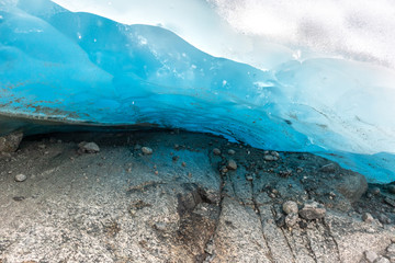 Bright blue ice glacier close up. Norway mountains