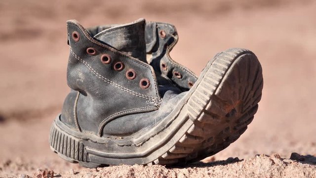 Old boot sways in the wind