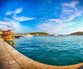 Fototapeta premium Famous Adriatic resort Makarska with picturesque harbor and touristic boats