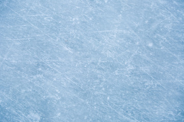 texture of ice on the rink with skating traces 
