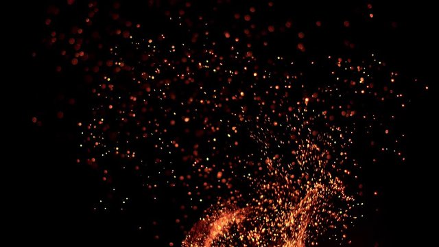 Super slow motion of fire sparks isolated on black background. Filmed on high speed camera, 1000 fps