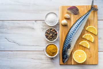 Obraz na płótnie Canvas Fresh raw mackerel fish with cooking ingridients
