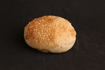 delicious bread rolls on colored background