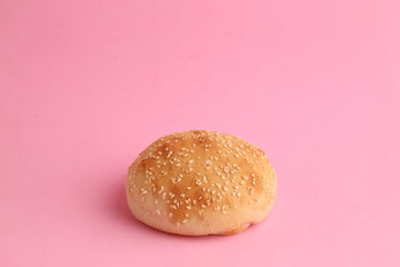 delicious bread rolls on colored background