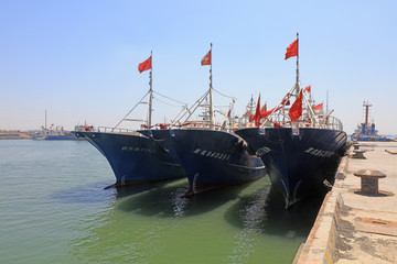 Naklejka premium Fishing boats moored at fishing port wharf, Luannan County, Hebei Province, China