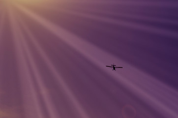 Small plane flying through the sky. background