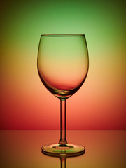 Glass close-up neon colored red green light gradient background