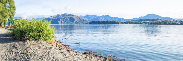 Fototapeta na wymiar Lake Landscape, Beautiful Blue Sky And Water, Lake Wanaka, New Zealand
