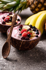 Acai bowl in coconut plate.