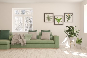 Stylish room in white color with sofa and winter landscape in window. Scandinavian interior design. 3D illustration