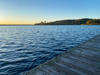little wood pier at Miramar lake before sunset twilight. San Diego, California, USA.