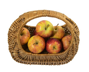 Apples in a basket on a white background, isolate.Autumn harvest of fruits.A brown wicker basket, for products.