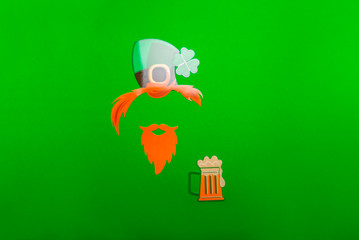 Different photo booth props for St Patricks Day party, top view, green background