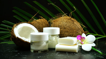 Healthy nutritious natural coconut with a vast range of dietary and cosmetic advantages and uses, shown here with cosmetic uses for soaps, moisturisers, and coconut husk products.