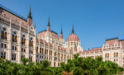 Budapest / Hungary - August 29 2019:Hungarian Parliament building in the city of Budapest. A sample of neo-gothic architecture, Budapest's tourist attraction