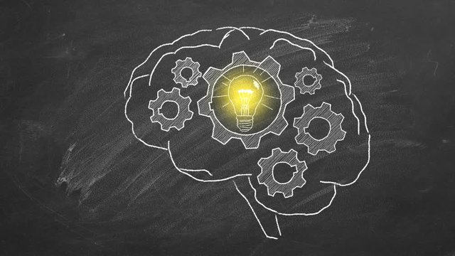 Rotating gears inside the human brain. Illustration on blackboard. Idea's generator
