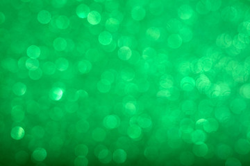 Abstract shiny circular green bokeh background. Spring