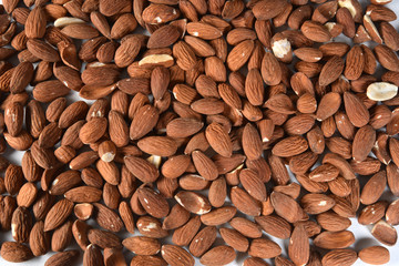 nutritious natural almonds scattered on the table in aerial view