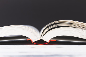 Open book on white table. Book binding background. Education concept.