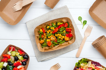 Steamed vegetables and brown kraft paper food containers