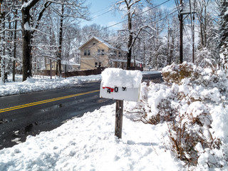 mailbox covered with snow the day after the snow storm