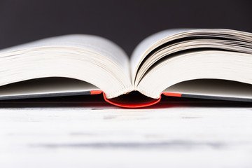 Open book on white table. Book binding background. Education concept.