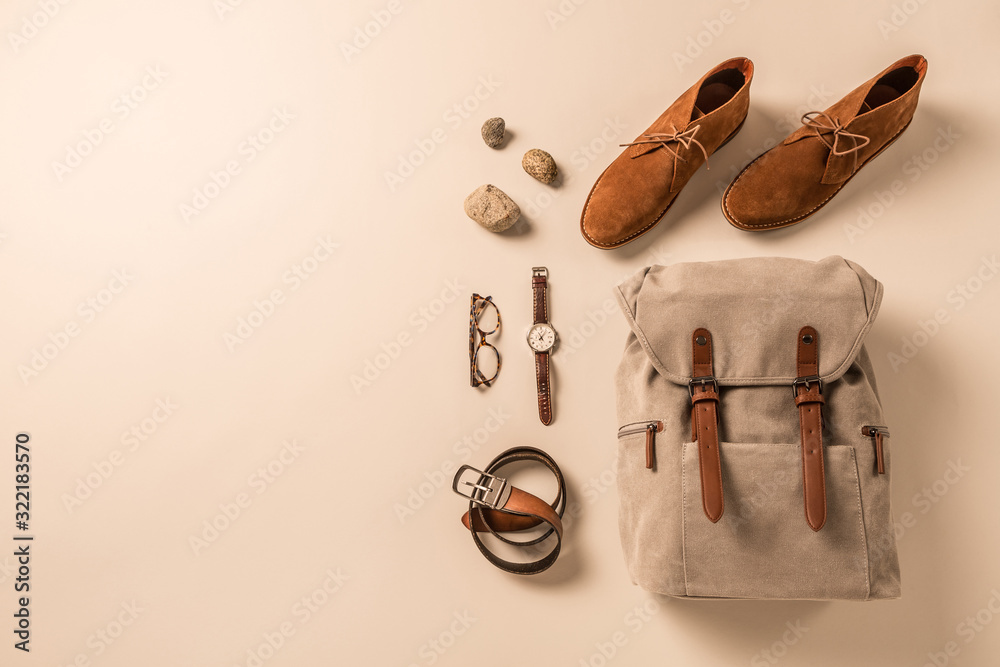 Wall mural men's accessories - camel shoes, khaki backpack and leather belt