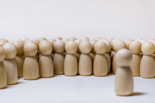 Follow The Leader Or Human Resource Management Concept. Crowd Of Wooden People