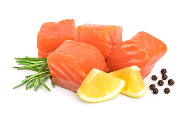 raw salmon piece cube with rosemary, lemon and peppercorn isolated on white background close up