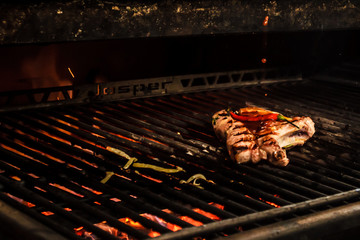 Sef roasts grilled meat. Close-up