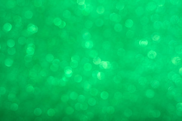 Abstract shiny circular green bokeh background. Spring