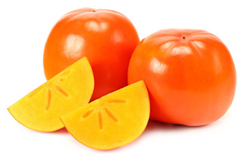 fresh ripe persimmons with slices isolated on white background