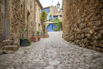 Nice old cobbled street in a small village of Catalan called Peratallada. Spain
