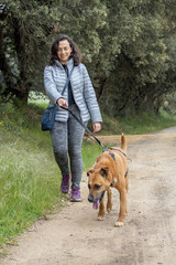 Pretty girl with a brown dog