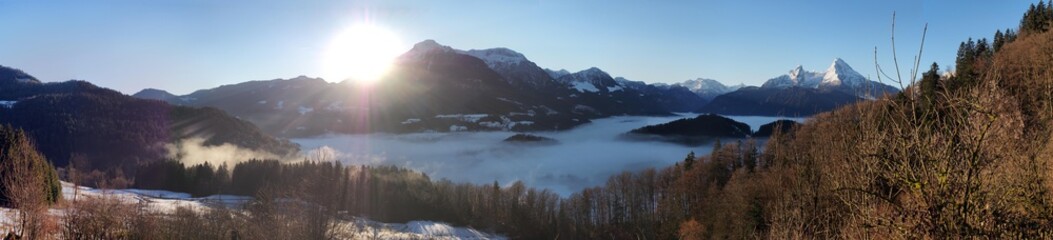 sunrise at Berchtesgaden with mountains and hills and fog in the valley, Watzmann to the right
