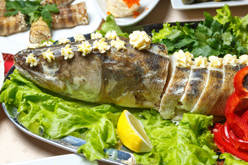 Stuffed fish in lettuce leaves