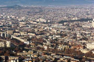 Fototapeta premium Tibilisi cityscape. Georgia high hill sunny winter landscape.