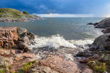 Finland. Landscape of the coast of Finland. View of the Gulf of Finland from the shore. Panorama of the bay. Waves splashing against stones on the shore. Nature of Helsinki. Travels.