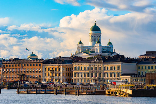 Helsinki. Finland. St. Nicholas. Cathedrals. Embankment of the Finnish city. Suurkirkko Temple in Helsinki. Finnish Capital on a sunny day. Domes of the Orthodox Church rise above the buildings