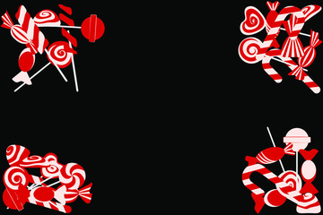 Red and white candies on black background. Postcard.