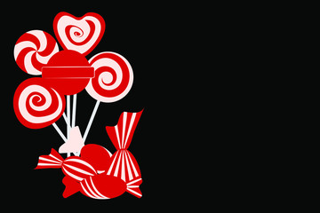 Red and white candies on a black background. Postcard.